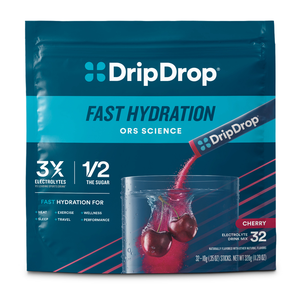 A package of DripDrop Fast Hydration electrolyte drink mix in cherry flavor. The front of the dark blue pouch features the DripDrop brand logo, product name, 'ORS Science' branding, and a graphic showing a glass of water with a red liquid streak and two cherries.
