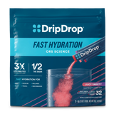 DripDrop Fast Hydration electrolyte drink mix pouch in Juicy Variety flavor, showing a clear glass with pink liquid and powder packets being poured, on a white background.