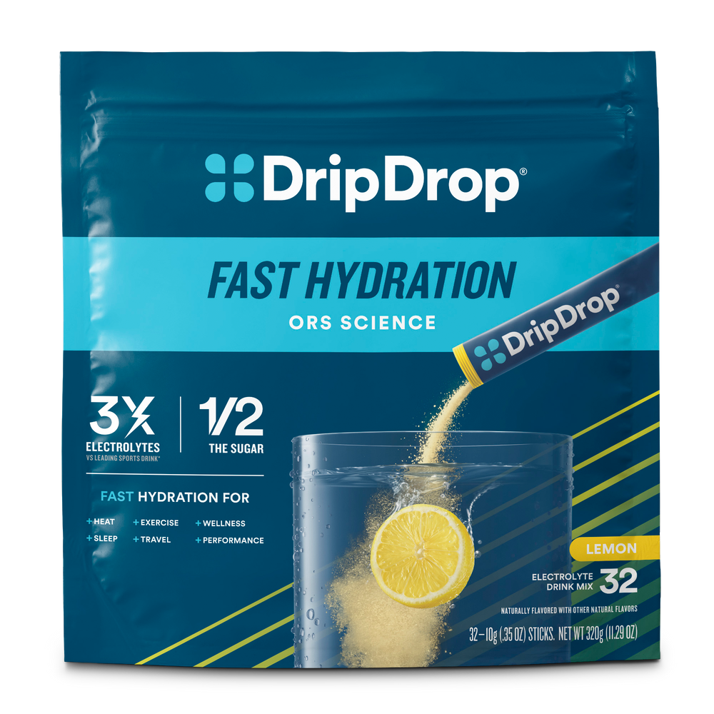 DripDrop Fast Hydration drink mix in a blue resealable pouch with lemon graphics and a glass of water with powder being poured, labeled Lemon flavor, 32 sticks.