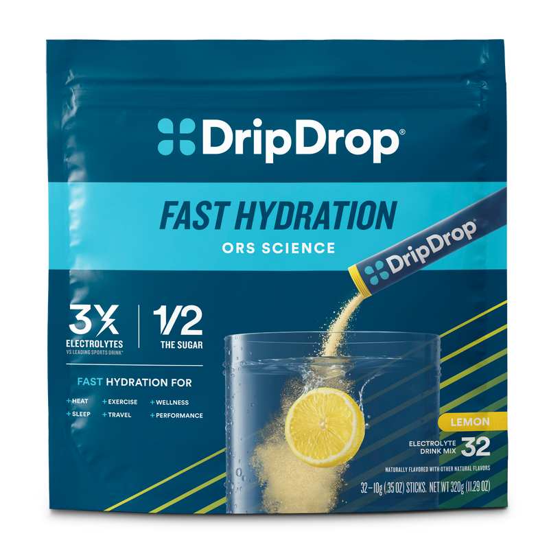 DripDrop Fast Hydration drink mix in a blue resealable pouch with lemon graphics and a glass of water with powder being poured, labeled Lemon flavor, 32 sticks.