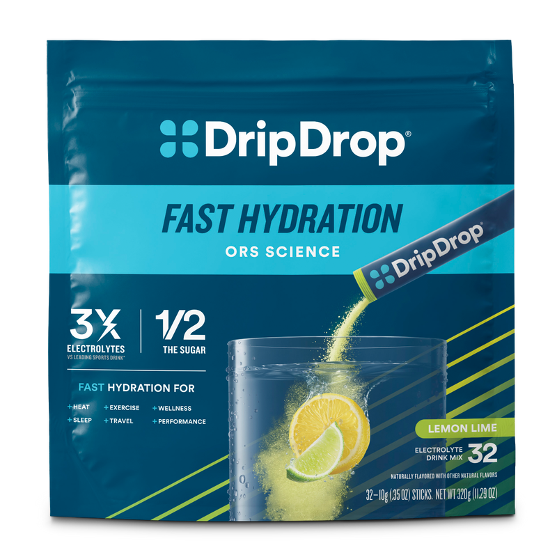 DripDrop Fast Hydration electrolyte drink mix in a pouch for Lemon Lime flavor. The packaging is dark blue with bright blue and yellow accents, featuring a graphic of a glass of water with lemon slices and lime, and a DripDrop stick being poured into it.