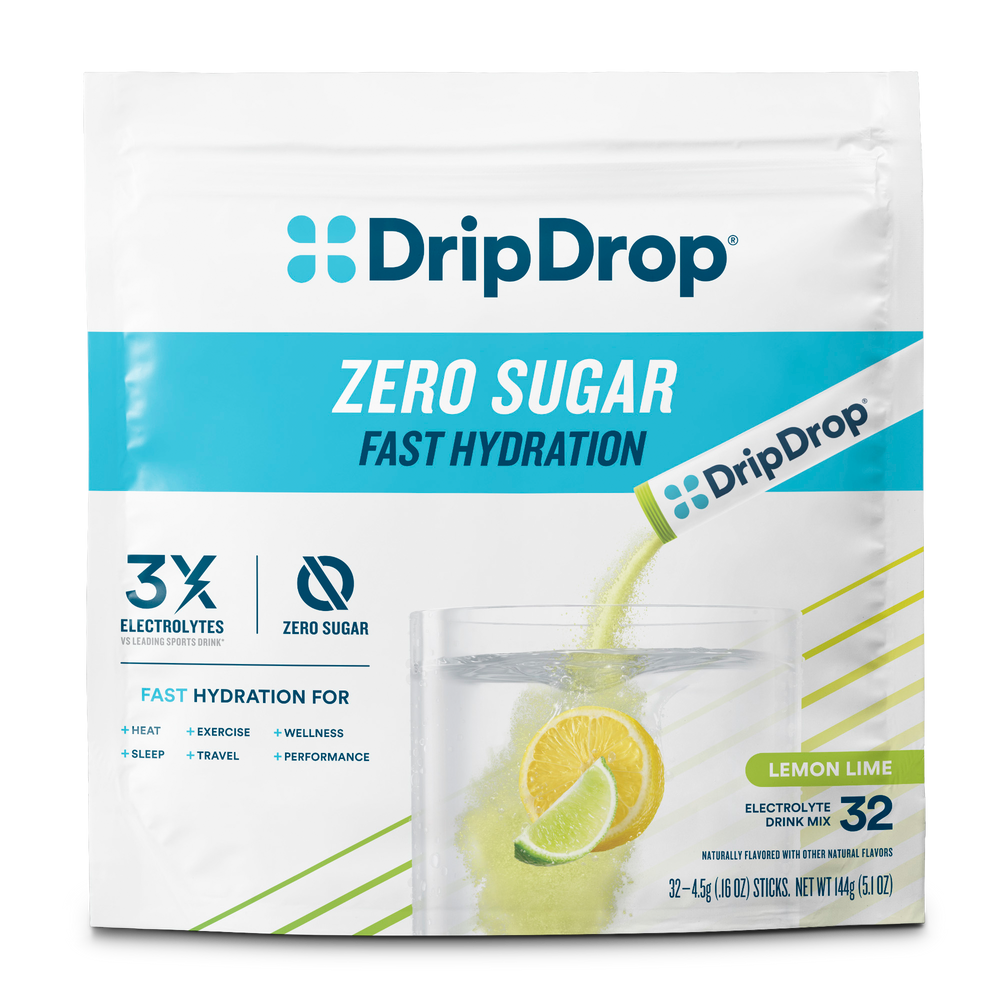 A package of DripDrop Zero Sugar Fast Hydration Lemon Lime electrolyte drink mix, featuring a white pouch with blue and lime-green accents and a graphic of a glass of water with lemon slices.