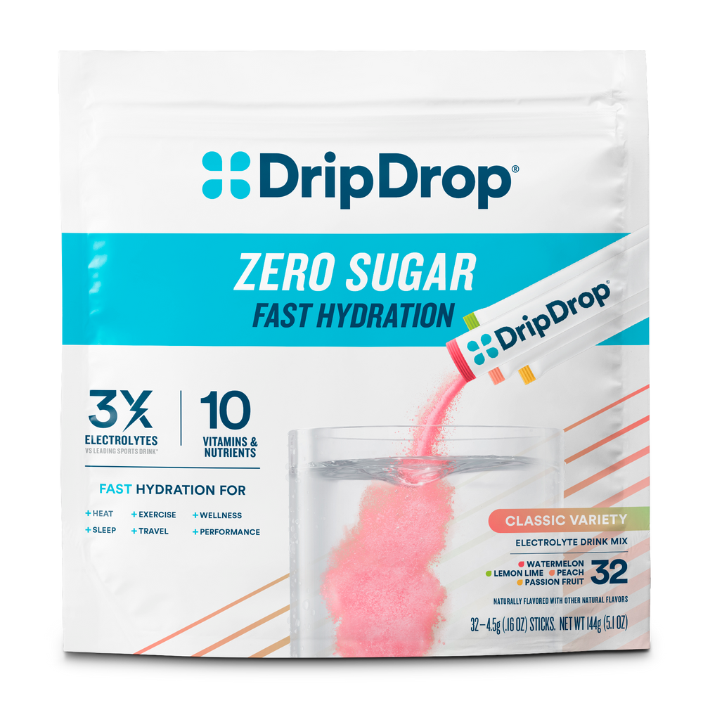 A package of DripDrop Zero Sugar Fast Hydration Classic Variety electrolyte drink mix. The white stand-up pouch features the blue DripDrop logo, text indicating 3x electrolytes and 10 vitamins, and a graphic of pink powder being poured into a glass of water.