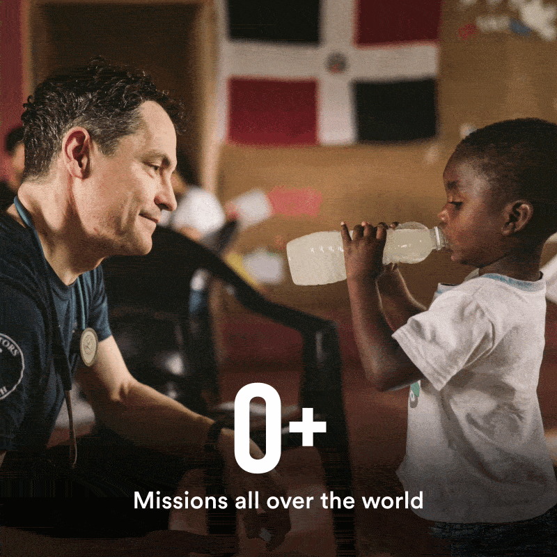 Dr. Dolhun giving a child DripDrop in a humanitarian setting with 20+ missions all over the world text overlay