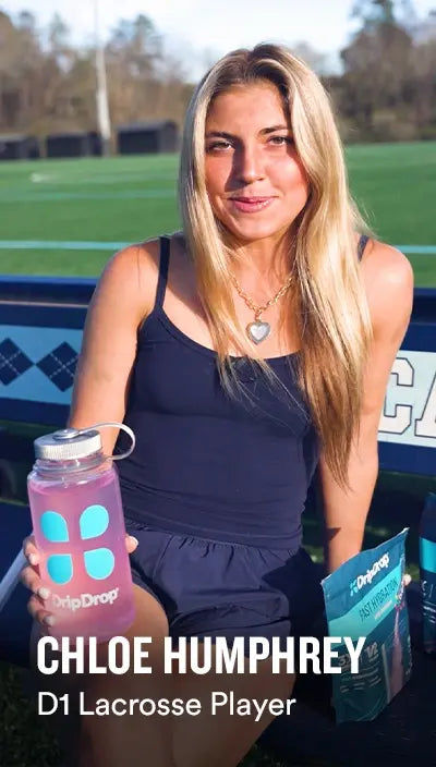 Chole Humphrey d1 Lacrosse Player holding a bottle of DripDrop on a lacrosse field