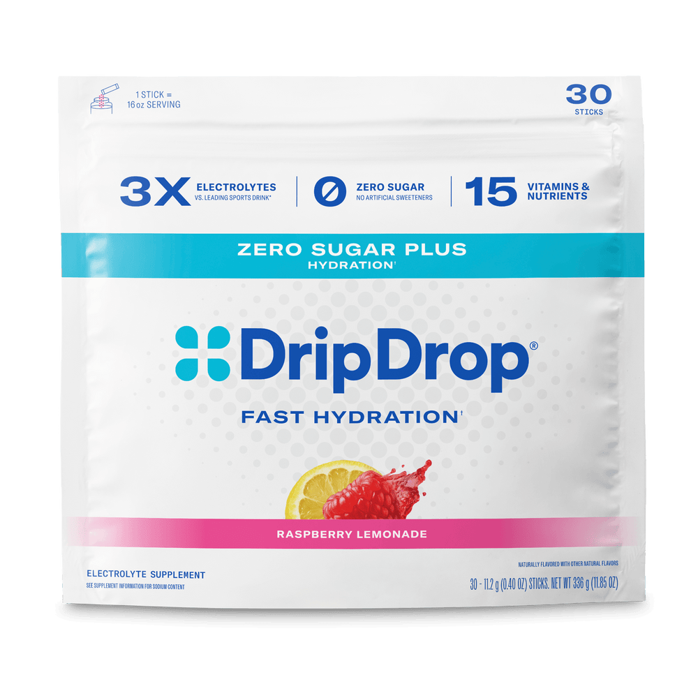 A package of DripDrop Fast Hydration electrolyte supplement in Raspberry Lemonade flavor. The white stand-up pouch features blue and pink branding, a lemon slice graphic, and text highlighting zero sugar and 15 vitamins and nutrients per stick.