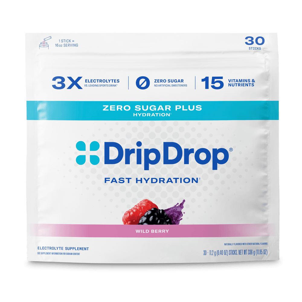 A package of DripDrop Wild Berry electrolyte supplement sticks, featuring a white pouch with blue and pink accents, on a clean white background.