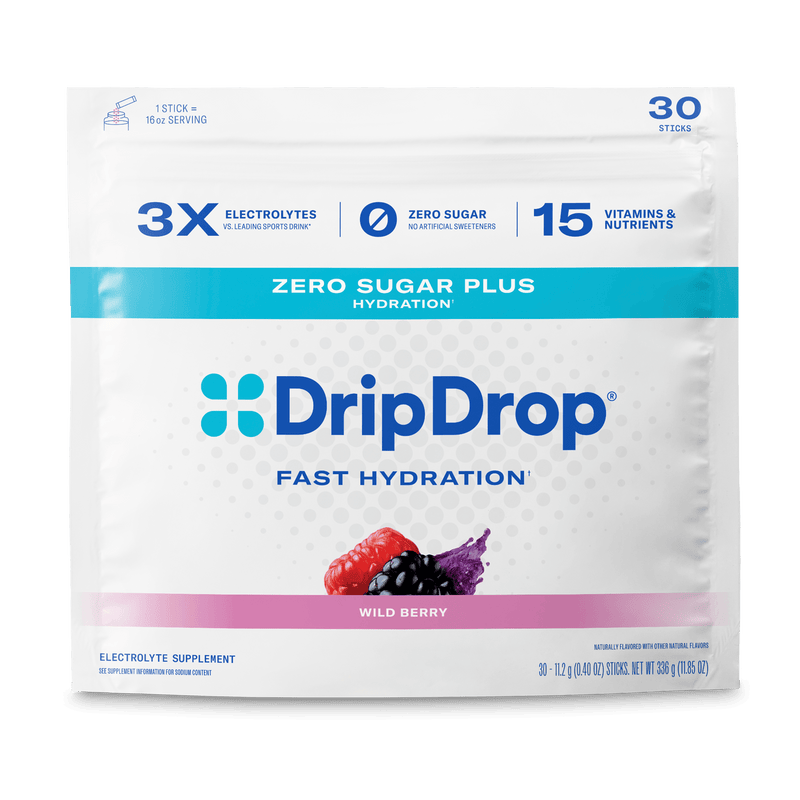 A package of DripDrop Wild Berry electrolyte supplement sticks, featuring a white pouch with blue and pink accents, on a clean white background.