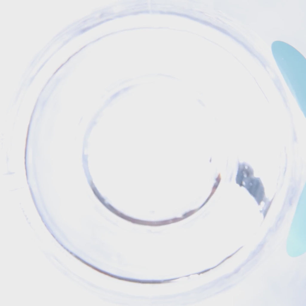 Powder being poured into a water bottle